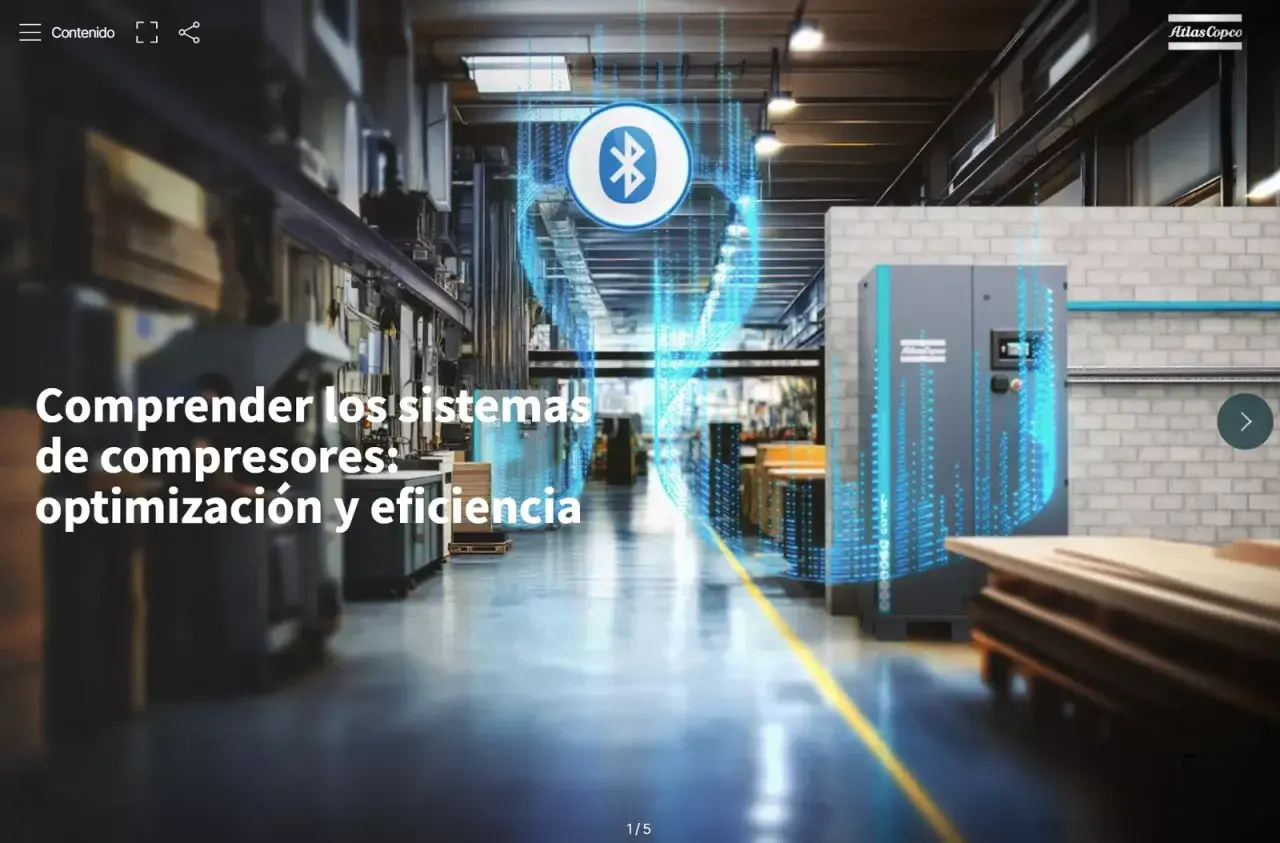 Interior de una fábrica con un compresor Atlas Copco y un icono de Bluetooth.